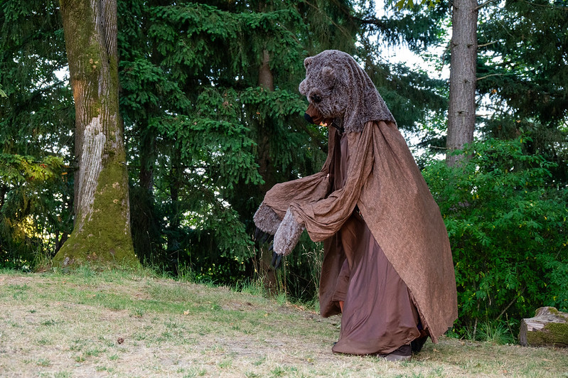 Exit pursued by a bear. Photo by Ken Holmes. Bear puppet by halfpinpuppets.com.